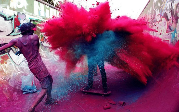 people playing holi with colours