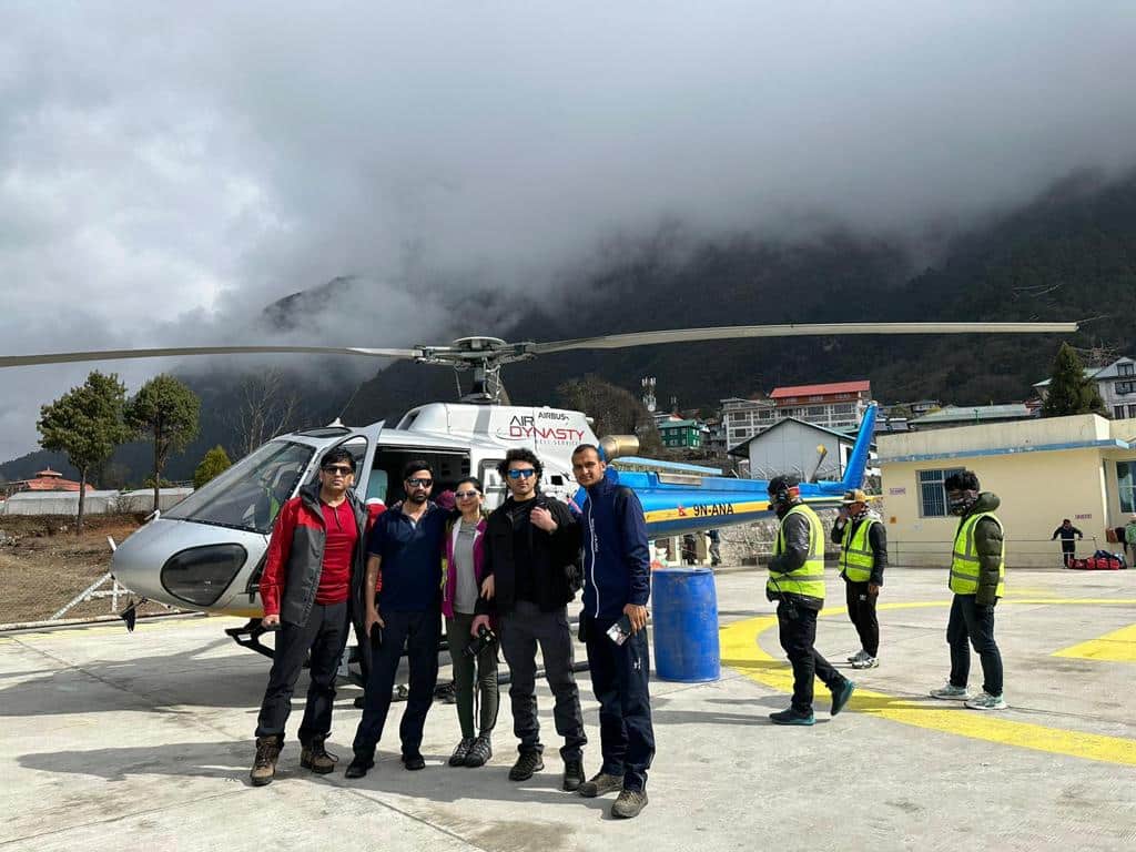 Standing infront of helicopter posing for photos in Lukla